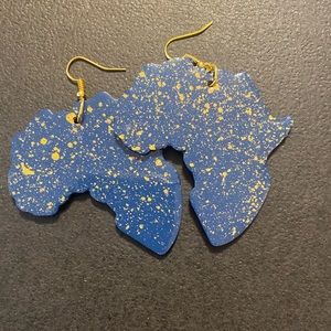Wooden earrings in the shape of the continent Africa. Navy blue with gold specks